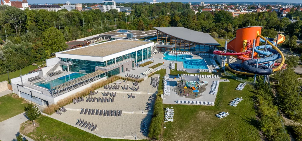 Aerial view of a modern outdoor swimming pool with lounge chairs.